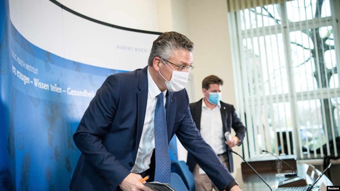 Lothar Wieler (L), head of Germany's disease control agency Robert Koch Institute (RKI), is seen during a news conference on the current situation regarding the coronavirus pandemic, in Berlin, Germany, Dec. 22, 2020. 