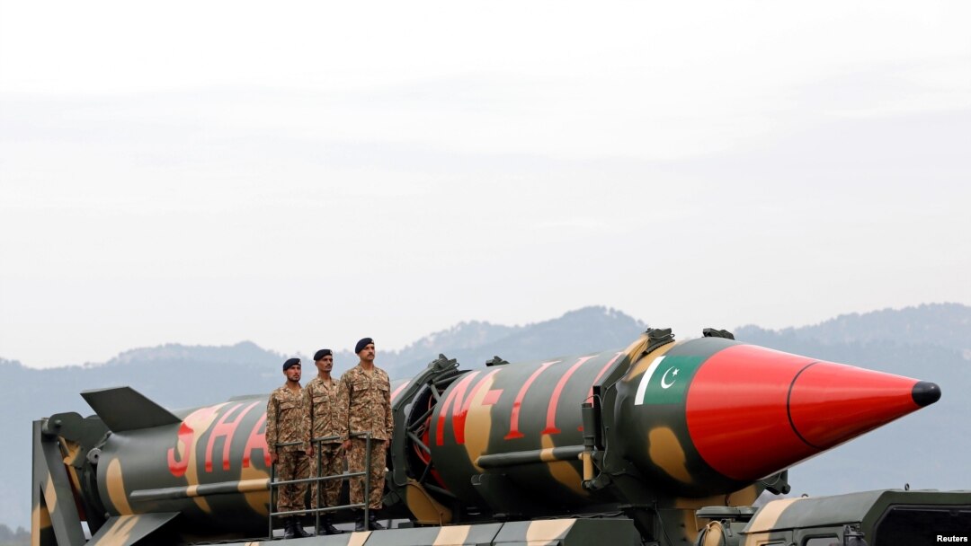 FILE - Pakistani military personnel stand beside a Shaheen III surface-to-surface ballistic missile during a Pakistan Day military parade in Islamabad, March 23, 2019. 