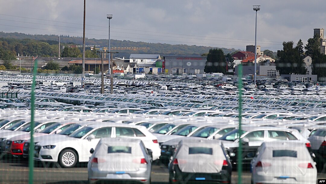 FILE - A picture taken on Sept. 25, 2015 shows cars parked at the logistics park of German auto giant Volkswagen in Villers-Cotterets. 