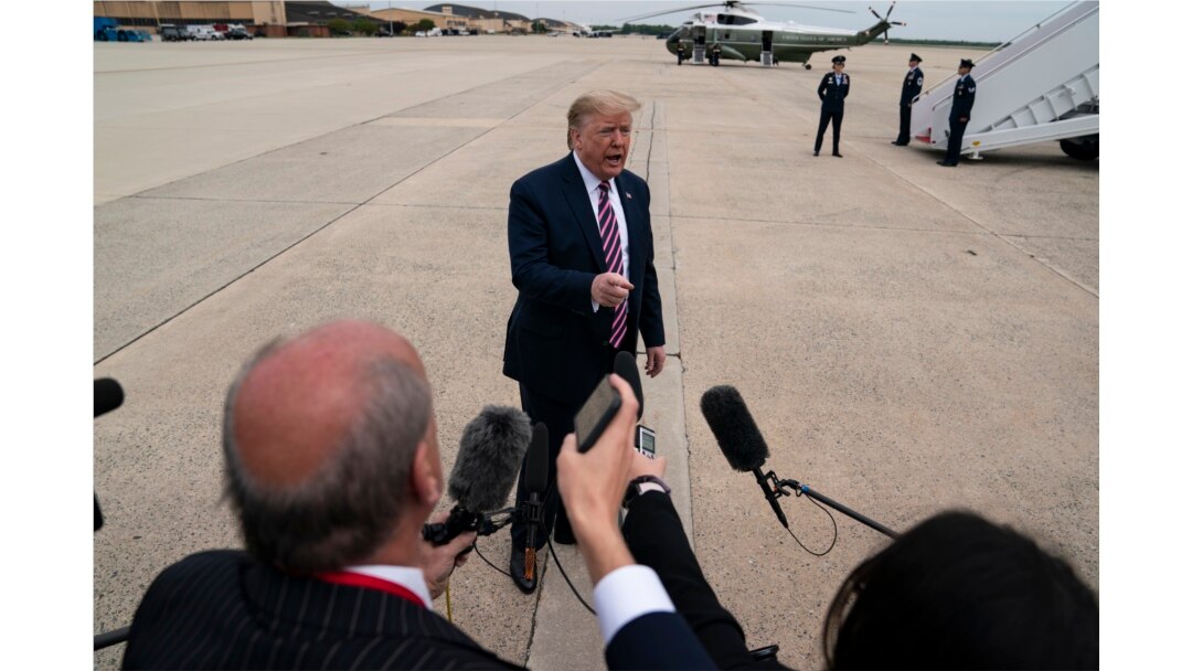 President Donald Trump talks to reporters before boarding Air Force One for a trip to Phoenix to visit a Honeywell plant that manufactures protective equipment, in Andrews Air Force Base, Md., May 5, 2020.