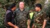 Brian Wilson, center, a U.S. citizen and former soldier from Ohio who has joined the Kurdish People's Protection Units (YPG), seen in the northeast Syrian Kurdish city of Qamishli, undated.