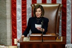 House Speaker Nancy Pelosi of Calif., readies to strike the gavel as she announces the passage of article II of impeachment against President Donald Trump, Dec. 18, 2019, on Capitol Hill in Washington.
