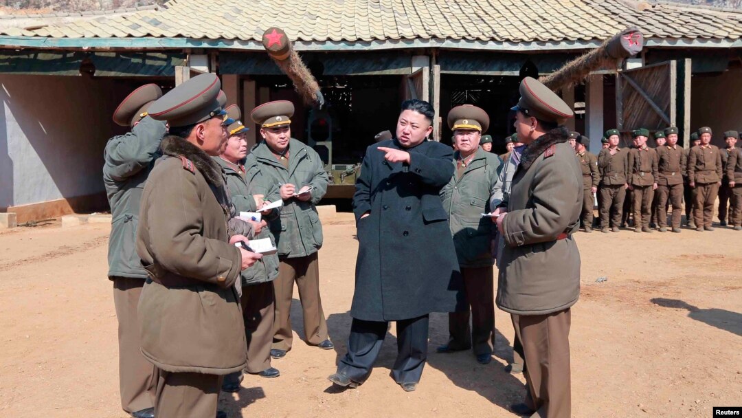 North Korean leader Kim Jong-Un (C) visits a long-range artillery sub-unit of the Korean People's Army Unit 641, March 11, 2013, in this picture released by the North's official KCNA news agency in Pyongyang, March 12, 2013. 