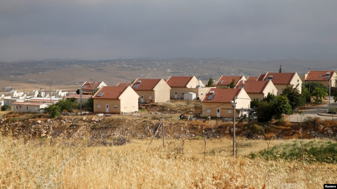 FILE - Houses are seen in the West Bank Jewish settlement of Karmel, near Hebron, May 24, 2016. 