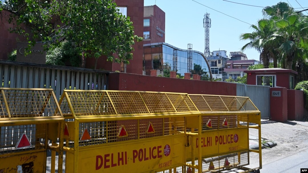 FILE - Police barricades are seen in front of the gate of the Twitter India's office at Crescent building in New Delhi on May 25, 2021, as police served a notice at Twitter's offices over flagged governments tweets as "manipulated media" a day before.