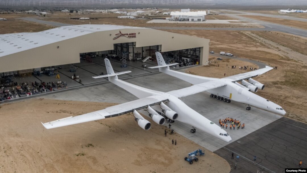 The world's largest plane, called Stratolaunch, is wheeled out of its hangar for the first time on May 31, 2017 at the Mojave Air & Space Port in California. (Stratolaunch Systems)