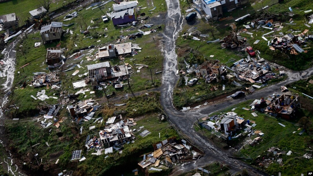 FILE - Destroyed communities are seen in the aftermath of Hurricane Maria in Toa Alta, Puerto Rico, Sept. 28, 2017. 