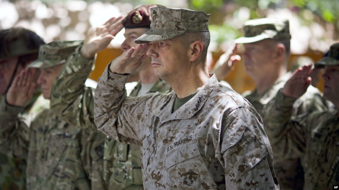Gen. John Allen, (C), the top U.S. commander in Afghanistan, salutes before he observes Memorial Day at ISAF headquarters in Kabul, Afghanistan, May 28, 2012. 
