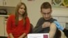 FILE - Meningococcal meningitis survivor and vaccination advocate Leslie Meigs looks on as her brother Andrew (18), a college student in Texas, receives Bexsero(R), a meningococcal group B vaccine approved by the FDA for ages 10-25. 