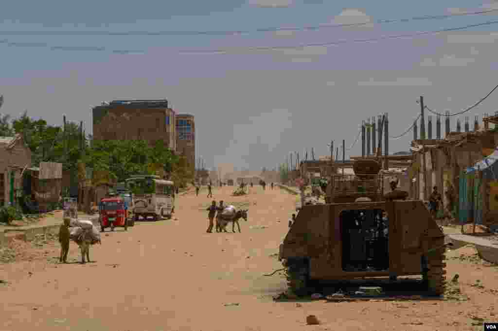 A destroyed armored vehicle lays in one of the mains streets of Hawzen, a small town in the frontline of the war in Tigray, Ethiopia, on June 6, 2021. (VOA/Yan Boechat)