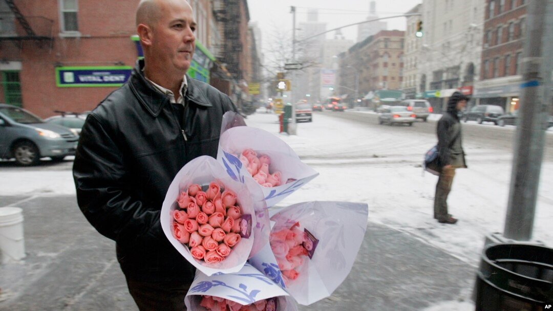 File -- John Wickersham bunches of roses he bought on New York's Upper West Side on Valentine's Day.