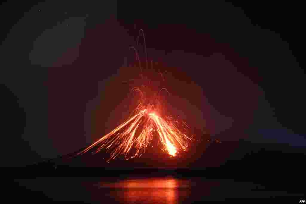 Lava streams down from Anak Krakatau (Child of Krakatoa) volcano during an eruption as seen from Rakata island in South Lampung, Indonesia.